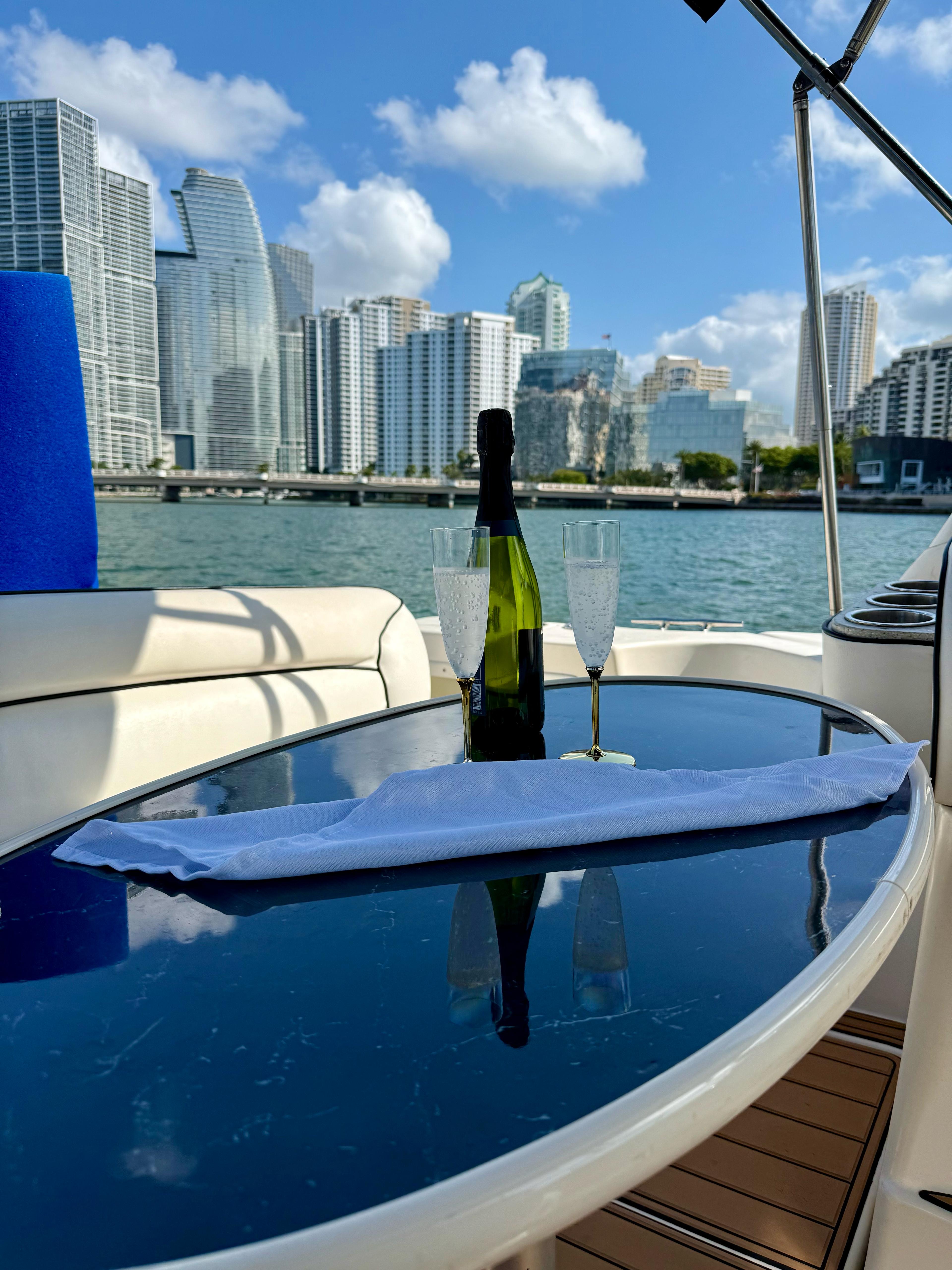 Champagne on deck with Miami skyline
